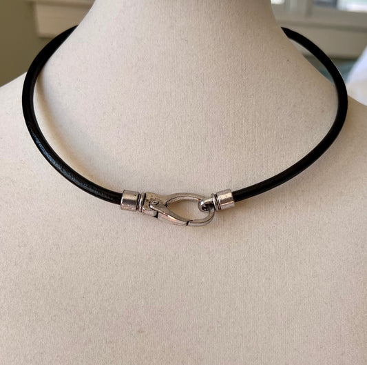Leather Necklace  Dark brown leather necklace with trendy and lovely large silver toggle clasp as center focal point.  17.4 inches long.
