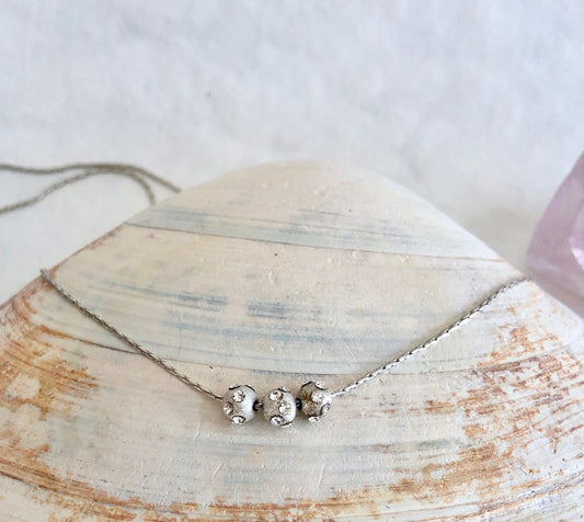 Sterling sliver beads with Swarovski inlaid, is strung on a lovely sterling chain. Beautiful graduation gift.