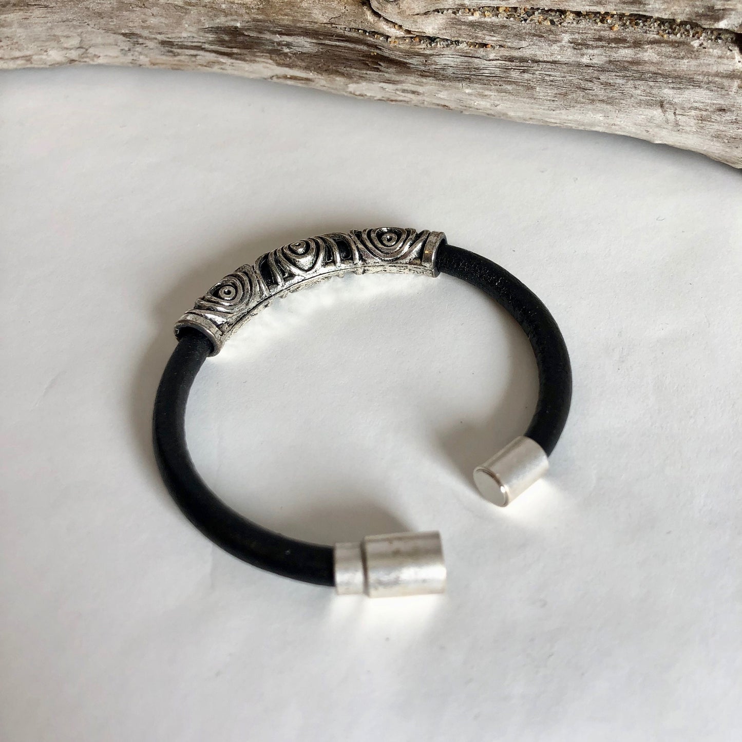 Leather bracelet, made of fine soft black Italian leather, accented with a gorgeous silver swirl slider, and a fine magnetic clasp.