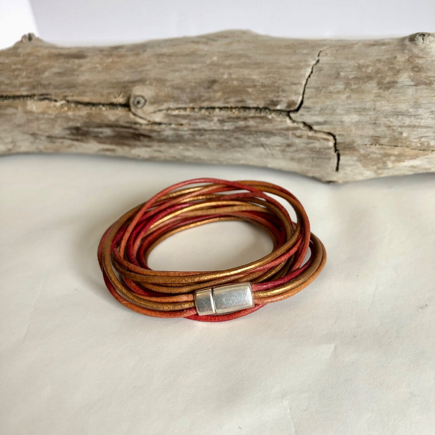 Leather bracelet, made of rows and rows of fine multi-color Italian leather, and finished with a quality silver magnetic clasp.