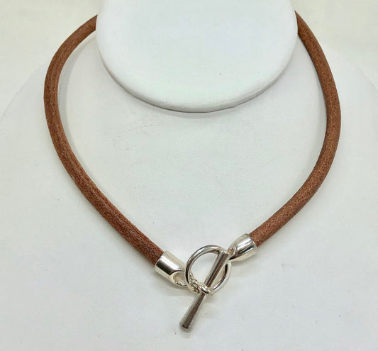 Beautiful Italian brown leather choker necklace fashioned with a center silver toggle clasp.
