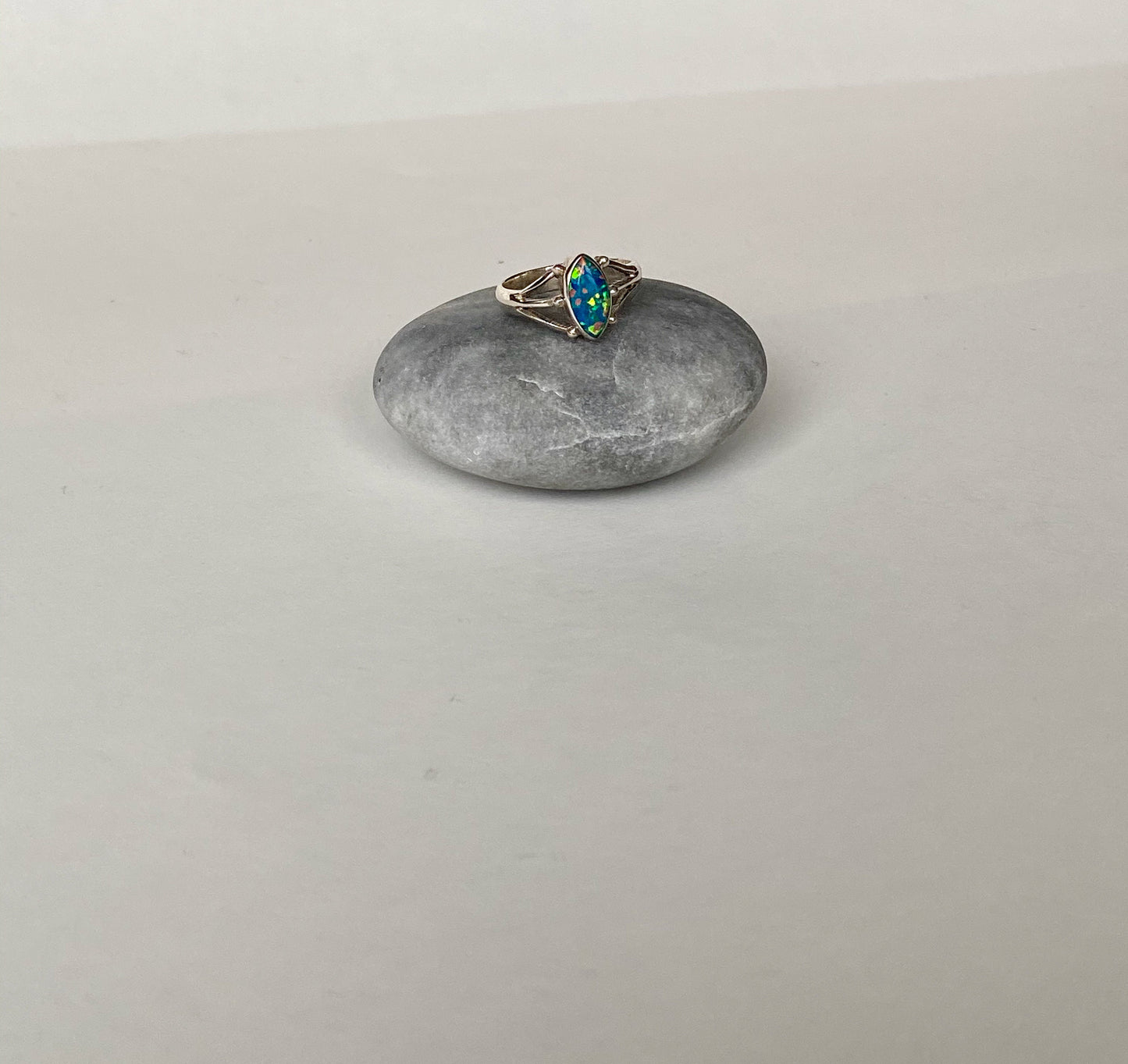 Beautiful size 5 3/4" blue fire opal and sterling silver ring.