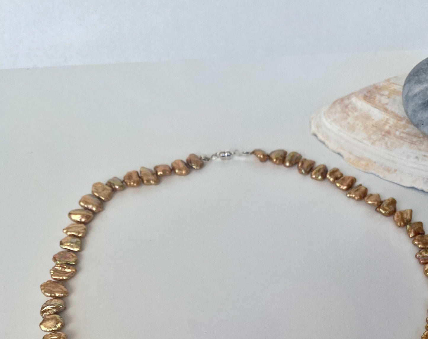 Pearls. Beautiful gold/bronze chip knotted fresh water pearl necklace. The necklace is finished with a quality sterling silver magnetic  clasp.