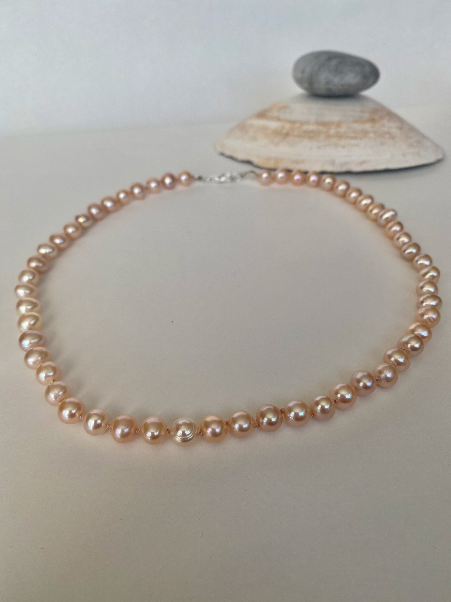 Pearls. Beautiful soft pink knotted fresh water pearl necklace. The necklace is finished with a quality sterling silver lobster clasp.