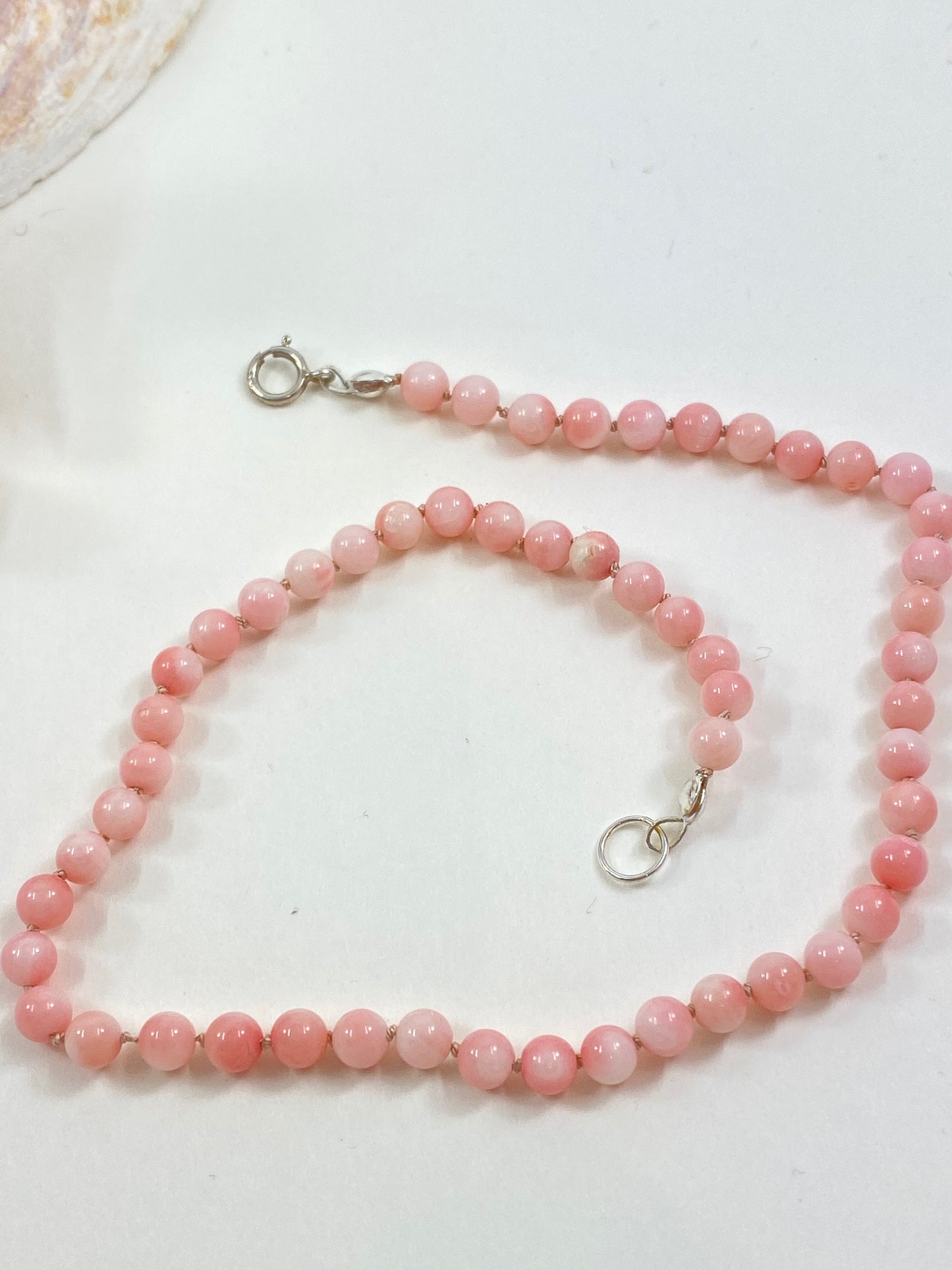 The sweetest girl's coral agate beaded necklace. Knotted for safety and styled for fun.