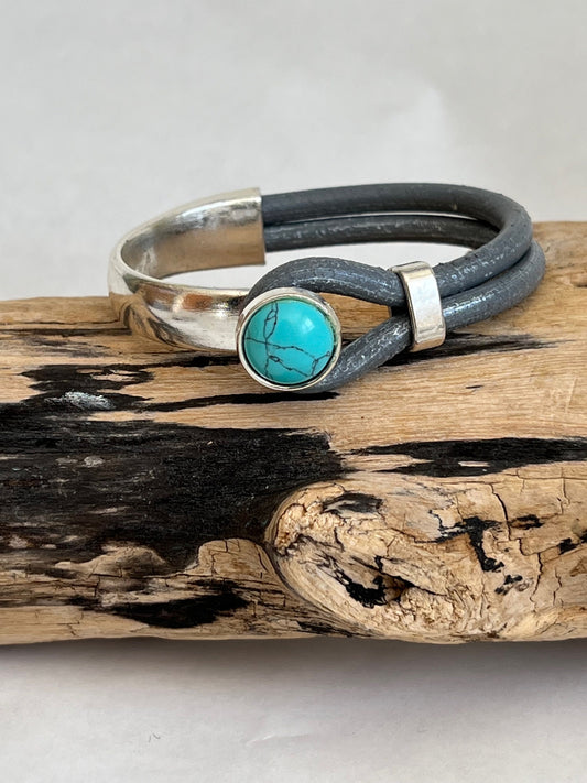Italian rich distressed gray leather bracelet with a turquoise button clasp. Half cuff style.  Gorgeous turquoise stone, soft leather and trendy clasp.