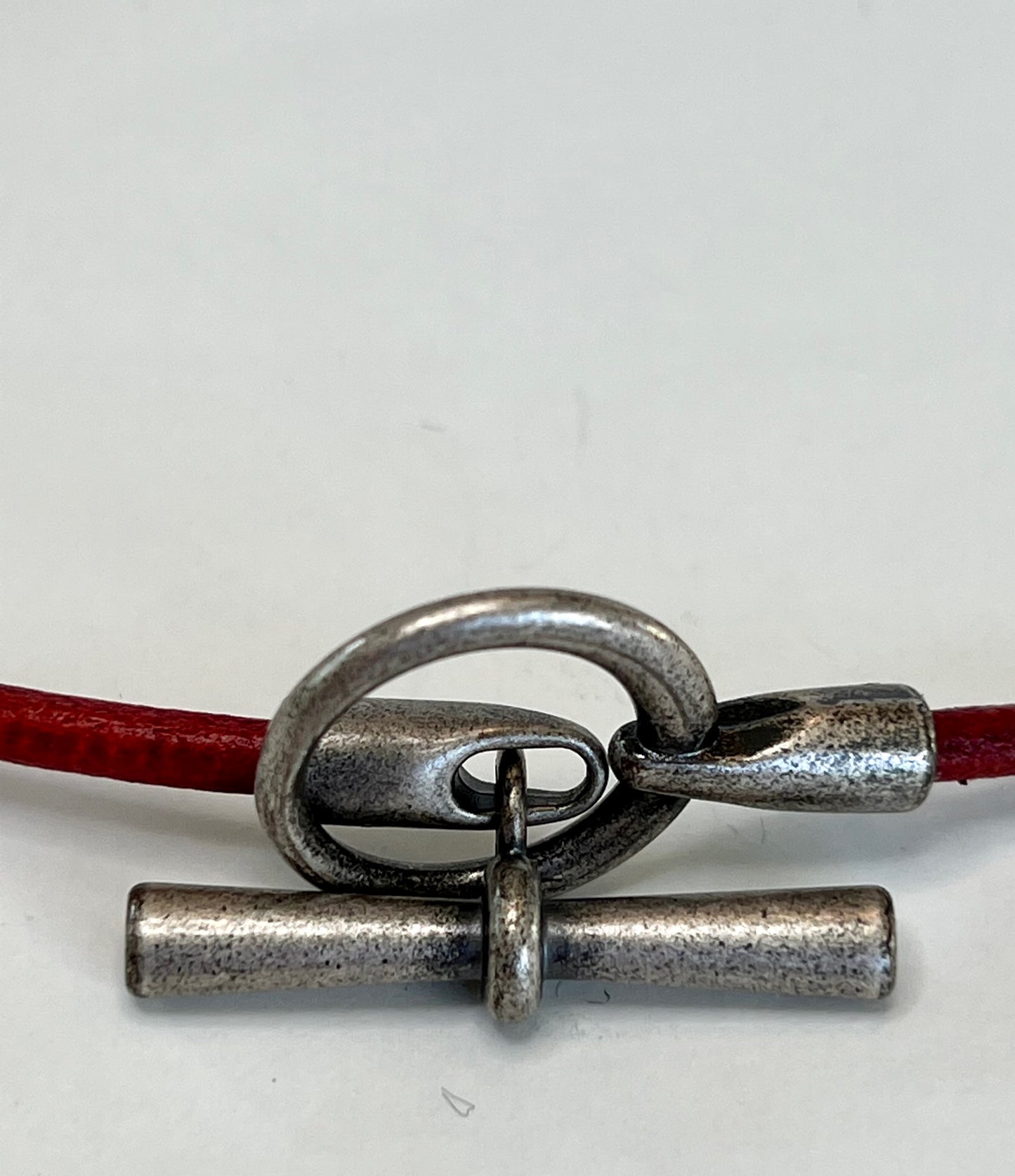 Leather Necklace. Red Italian leather choker necklace fashioned with a center silver toggle clasp.