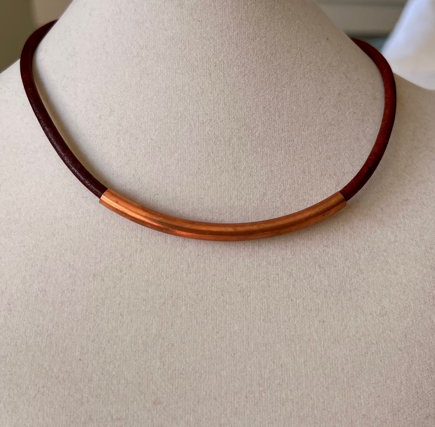 Leather Necklace  Beautiful rich brown Italian leather with center copper tube. Fixed with a copper magnetic clasp. 16.5" long.