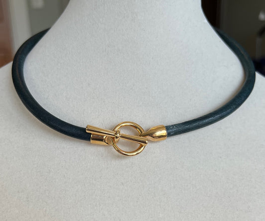 Leather Necklace  Dark distressed denim blue leather necklace with gold toggle clasp as center focus. 16" long.