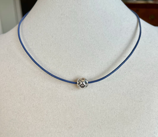 Leather Necklace  Lovely soft blue Italian leather necklace. Fixed with a silver magnetic clasp and a center sterling silver ornate ball.  17" long .Other sizes usually available to order.               Meant to be worn in elegance and joy.