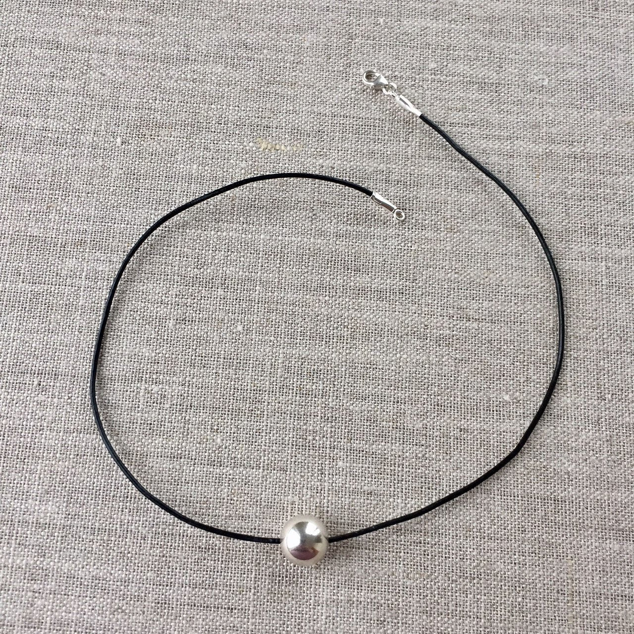 Black leather choker necklace with sterling silver ball strung on soft beautiful leather with sterling clasp