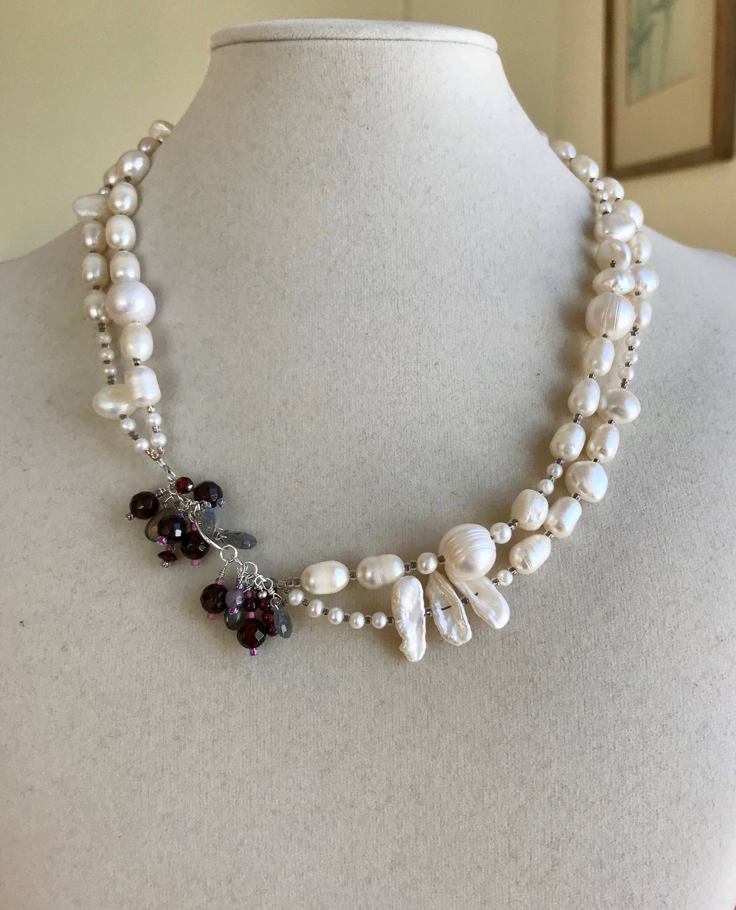 Pearls. Beautiful knotted fresh water pearl and garnet embellished necklace. The necklace is finished with a filigree gold clasp.