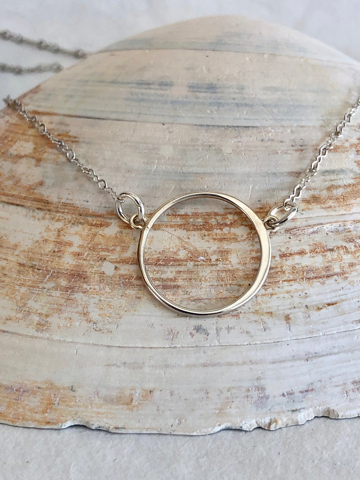 Sterling silver circle pendant. Strung on quality sterling silver chain. Beautiful graduation gift.