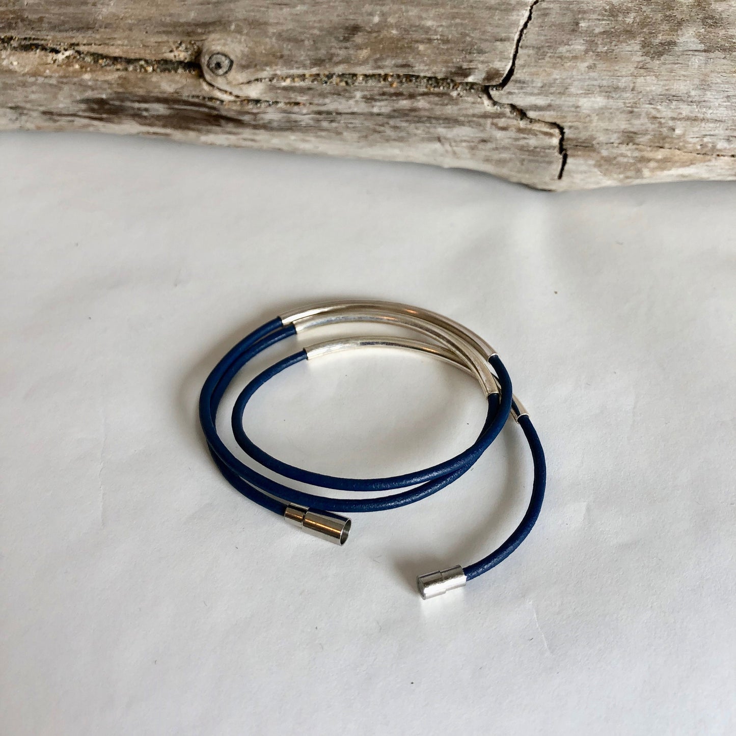 Leather bracelet, made of fine deep blue Italian leather, silver tubes, and finished with a quality silver magnetic clasp.