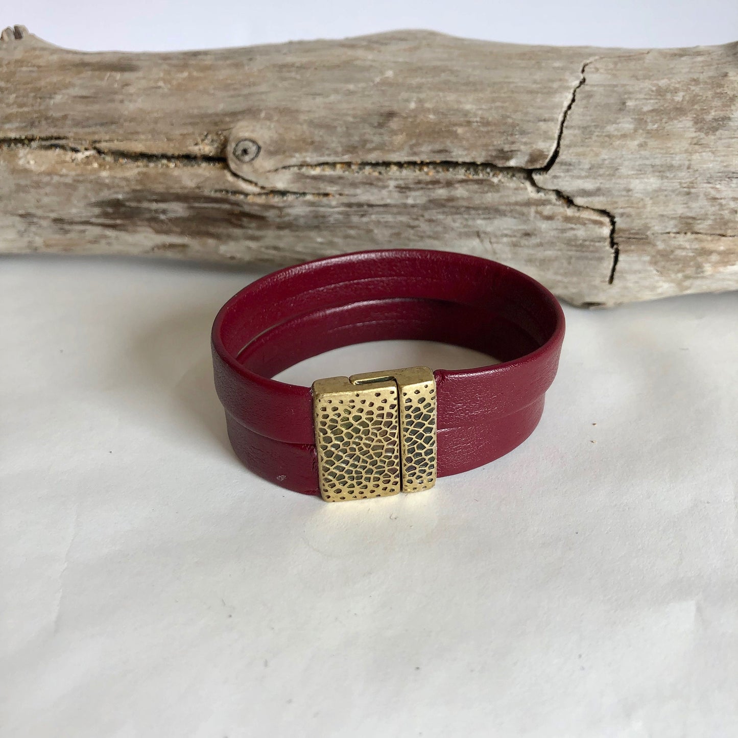 Leather bracelet, made of soft, fine deep red Italian leather, and finished with a quality distressed brass magnetic clasp.