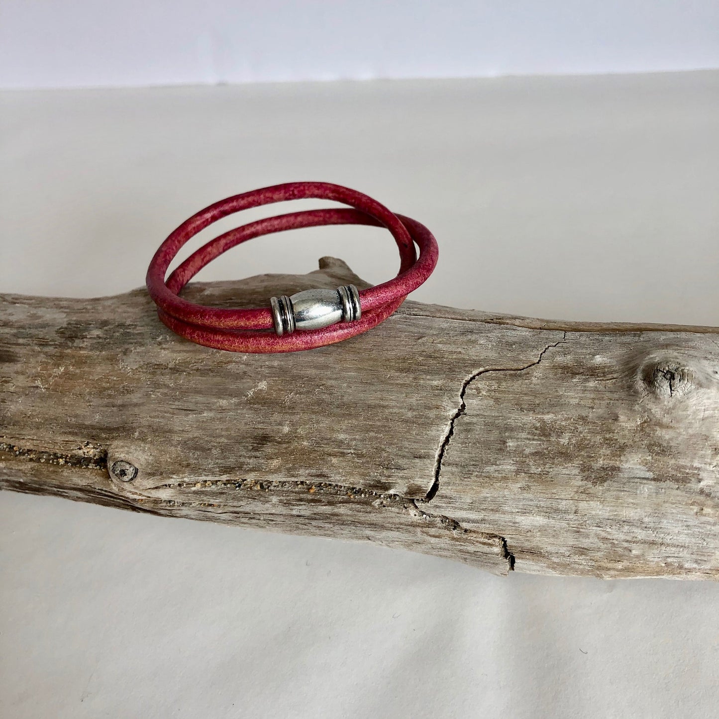 Leather bracelet, made of fine soft red Italian leather, and a fine magnetic tube clasp. Classic simplicity.
