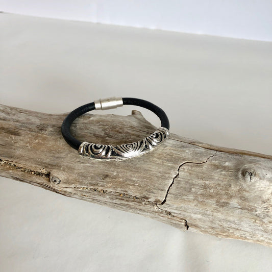 Leather bracelet, made of fine soft black Italian leather, accented with a gorgeous silver swirl slider, and a fine magnetic clasp.