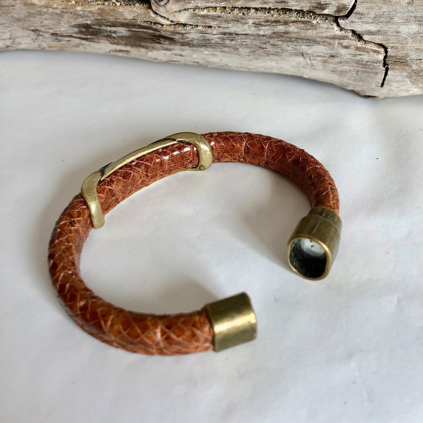 Leather bracelet, made of fine brown braided Italian leather, accented with a gorgeous brass eternity  swirl slider, and a  magnetic clasp.