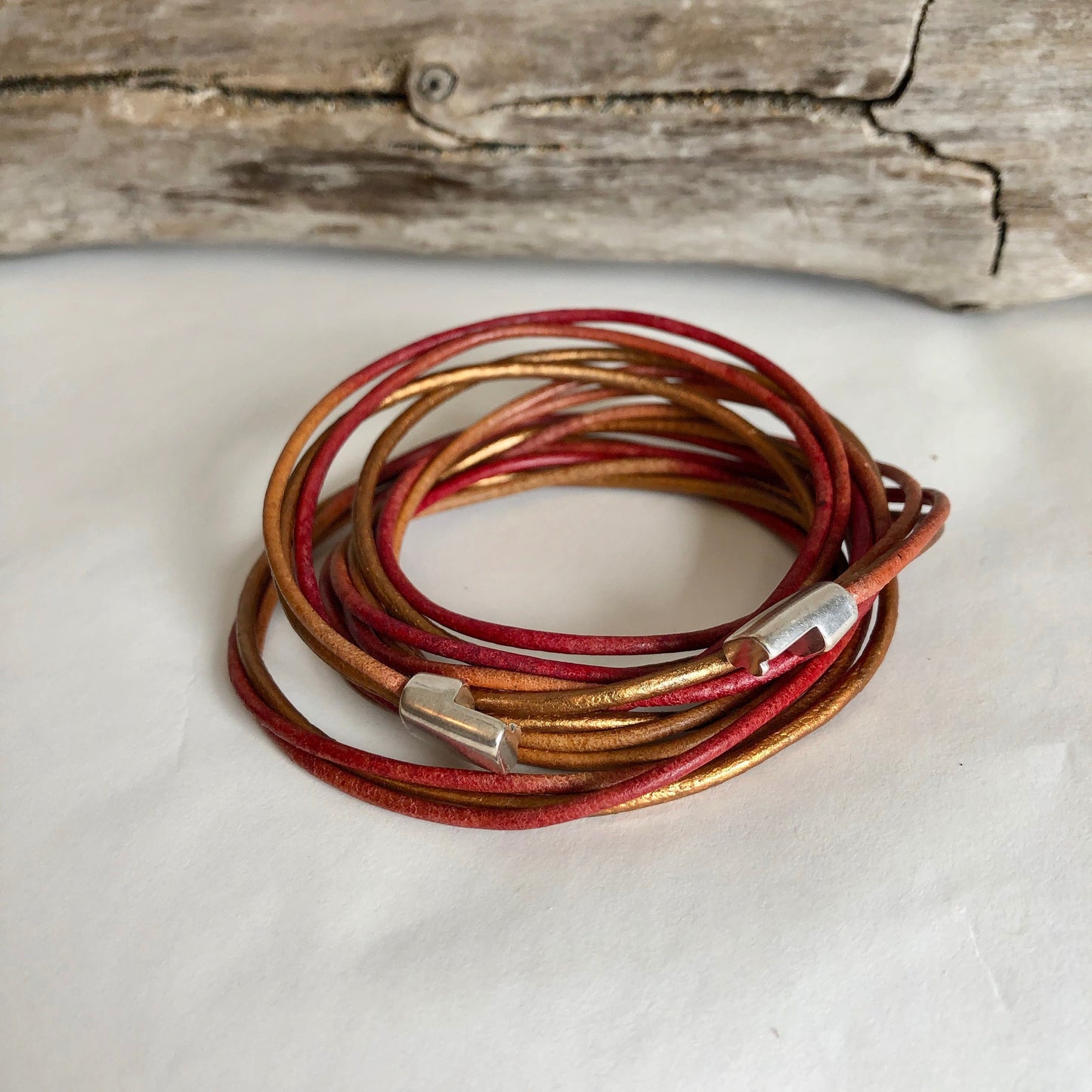 Leather bracelet, made of rows and rows of fine multi-color Italian leather, and finished with a quality silver magnetic clasp.