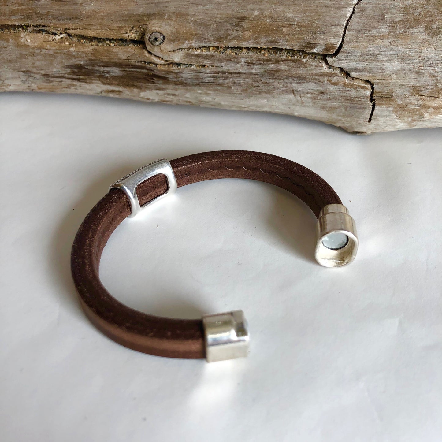 Leather bracelet, made of fine soft brown Italian licorice leather, accented with a gorgeous silver dotted slider, and a magnetic clasp.