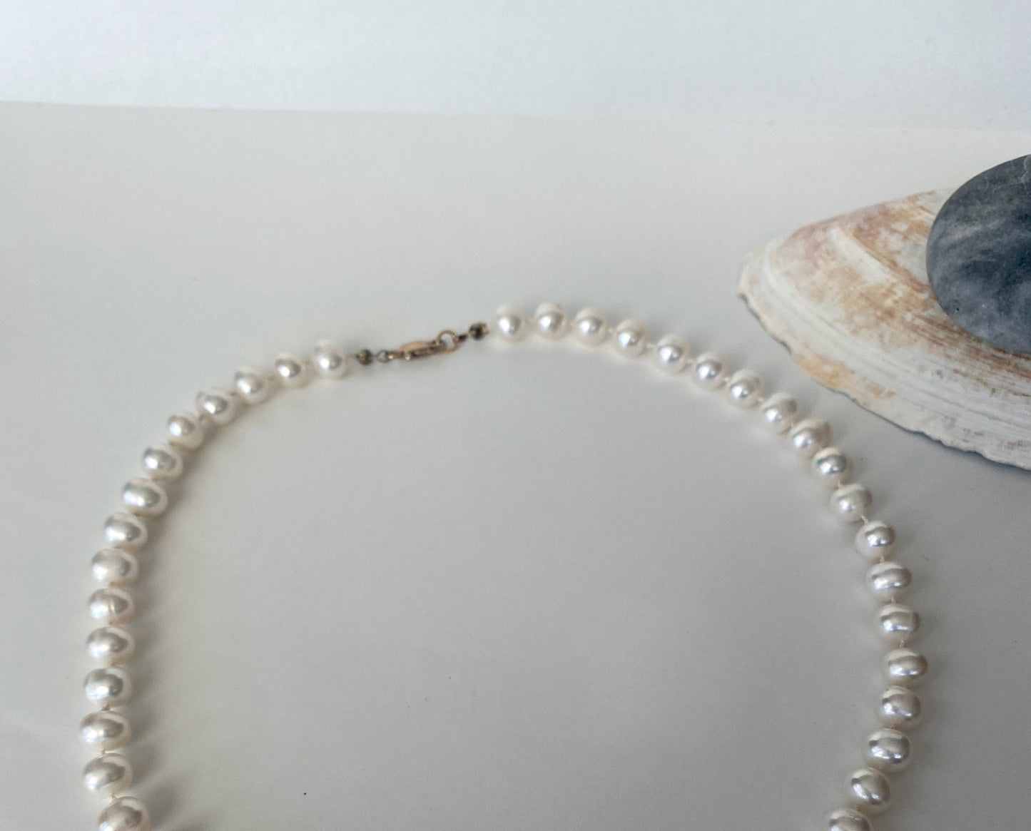 Gorgeous soft white knotted fresh water pearl necklace. The necklace is finished with a quality gold filled lobster clasp.