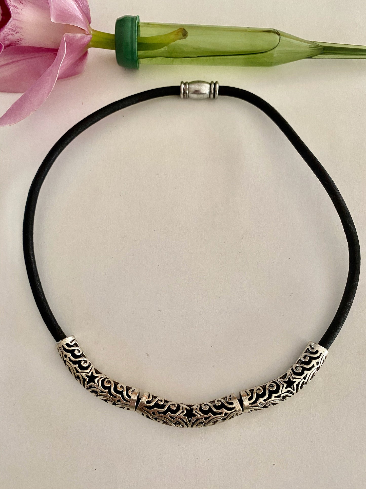 Leather Necklace. Beautiful black Italian leather choker necklace with three silver curved ornate tubes and accented with a magnetic silver clasp.