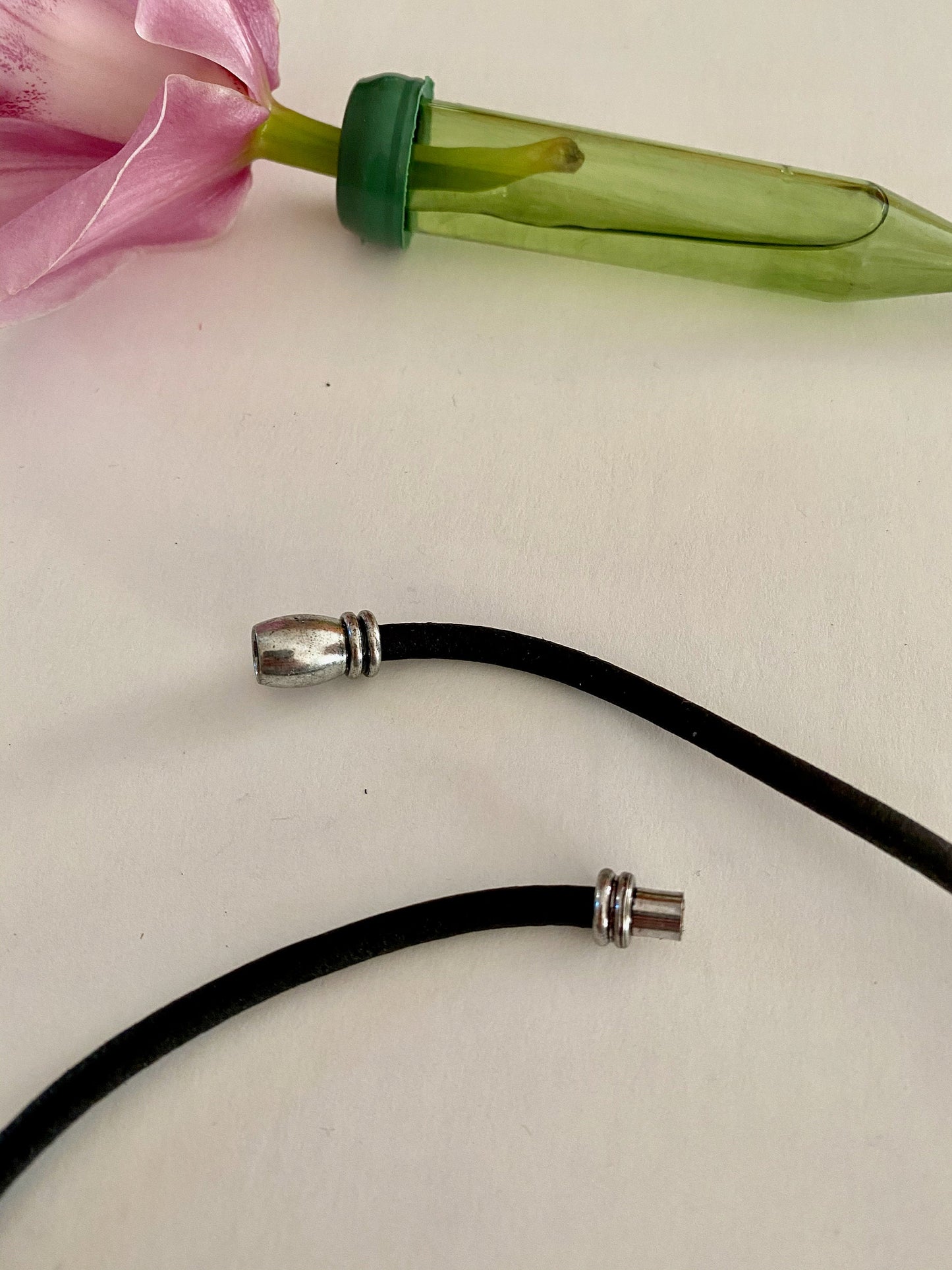 Leather Necklace. Beautiful black Italian leather choker necklace with three silver curved ornate tubes and accented with a magnetic silver clasp.