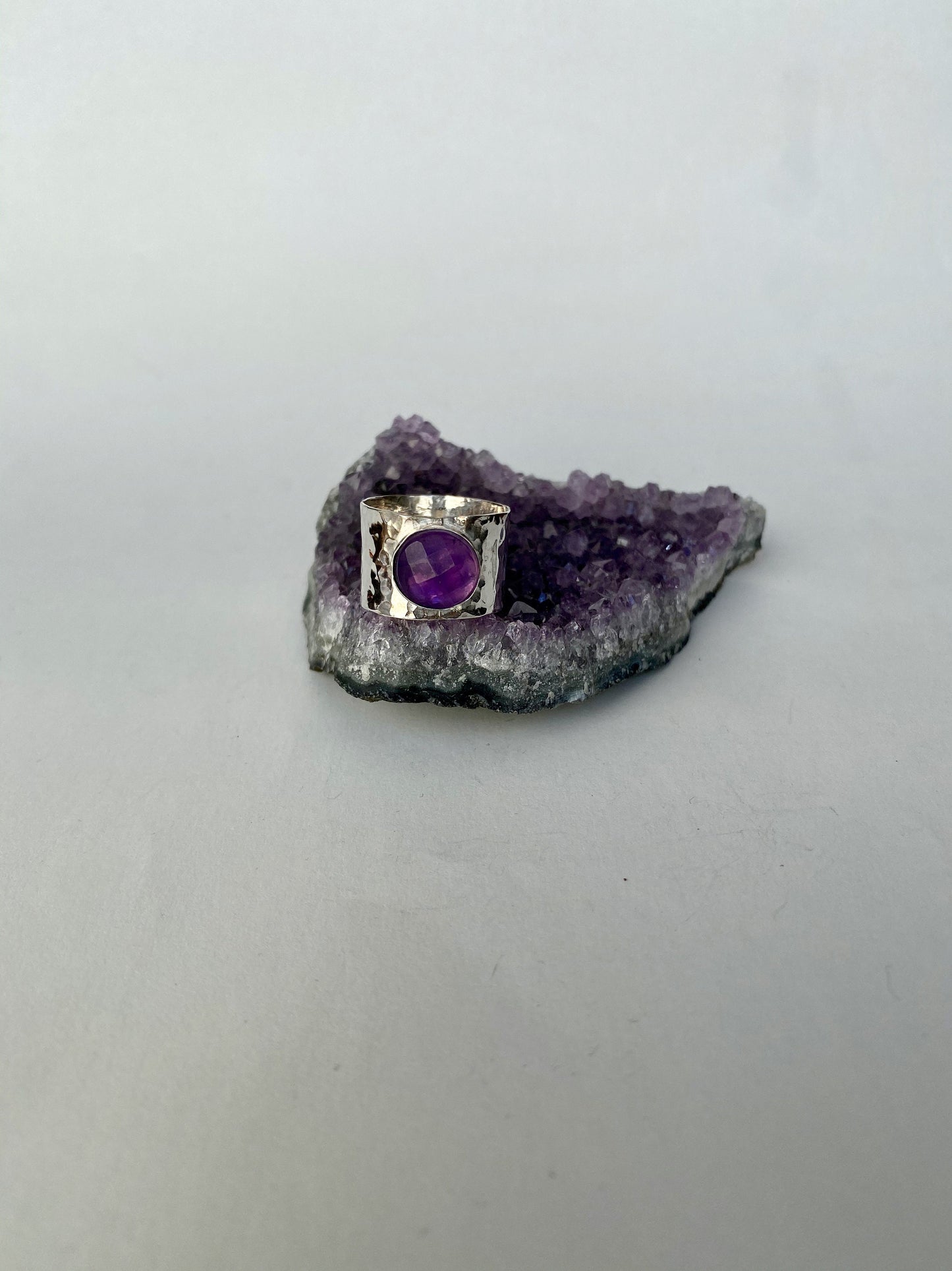 Striking size 6.5 handmade amethyst and sterling silver ring. Hammered band.