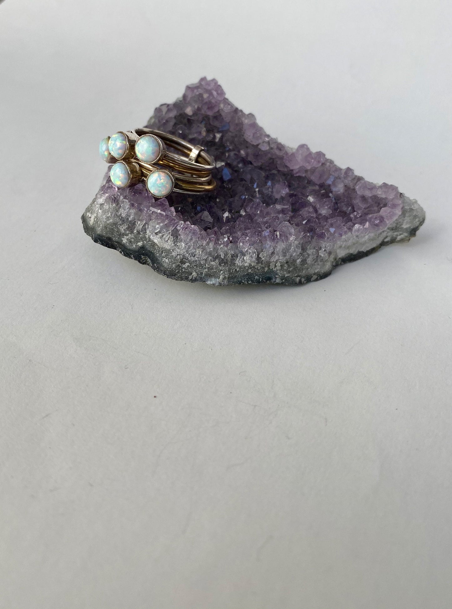 Handmade size 6.5 multi fire opal. Gold and sterling silver bands ring.
