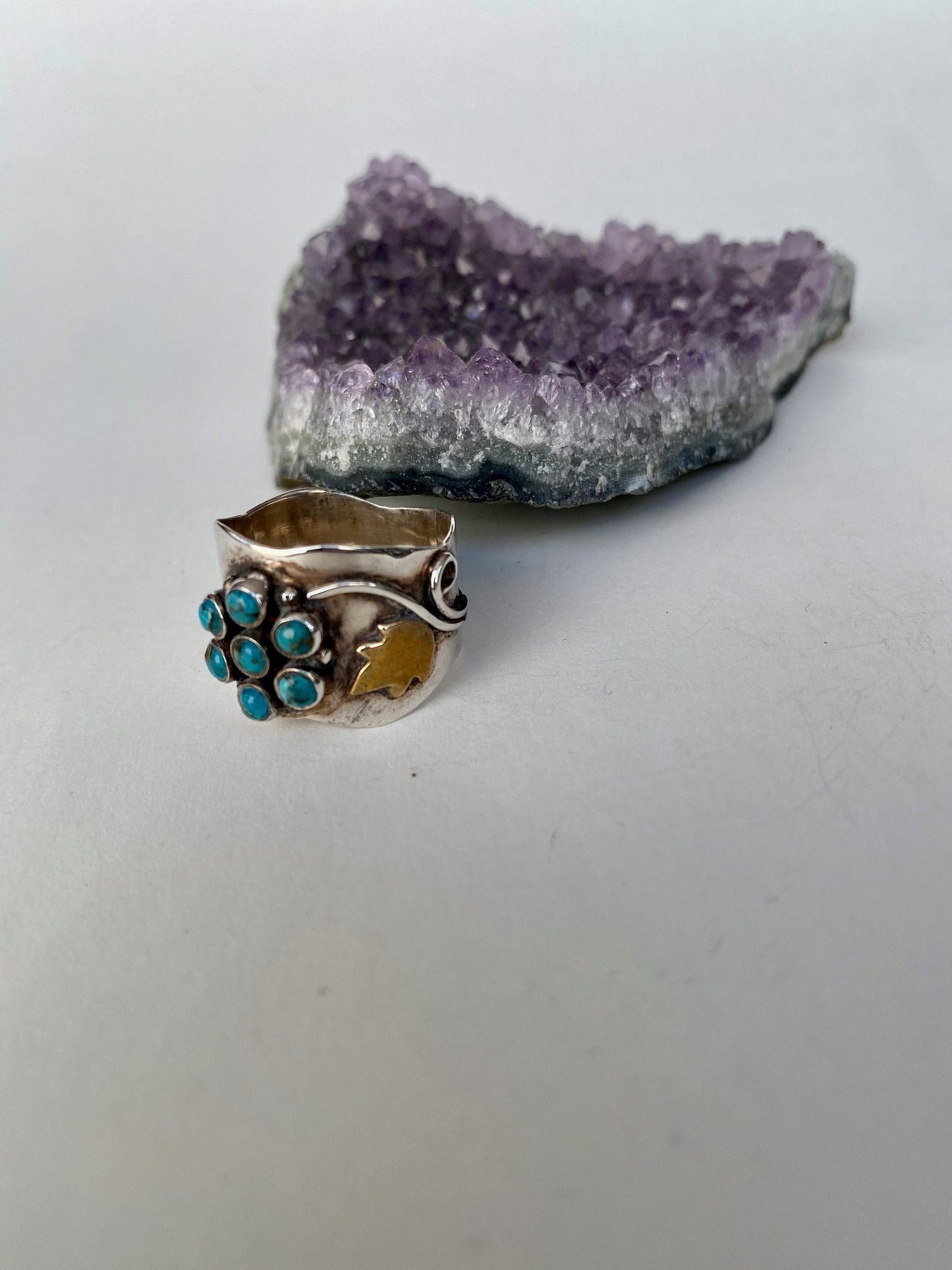 Handmade size 6 1/4 multi turquoise stone,  sterling silver band with gold accents.
