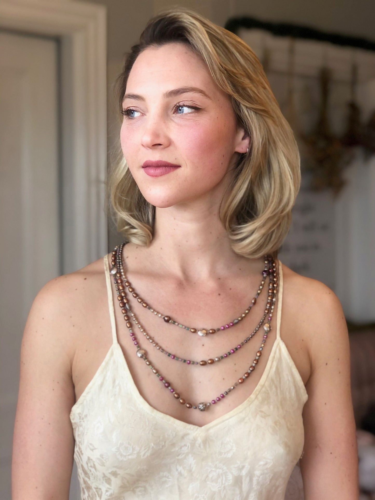 Fresh water pearls necklace  Rows and rows of red, brown, and taupe pearls are accented by crystals and quality sterling silver beads.
