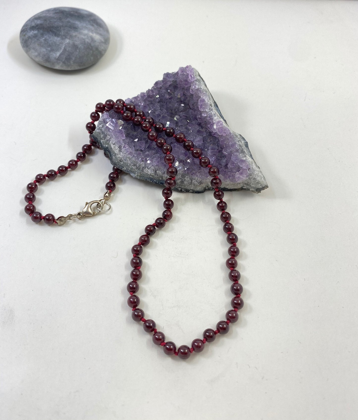 Exquisite garnet beaded and hand knotted necklace. Finished with a quality sterling silver lobster clasp.