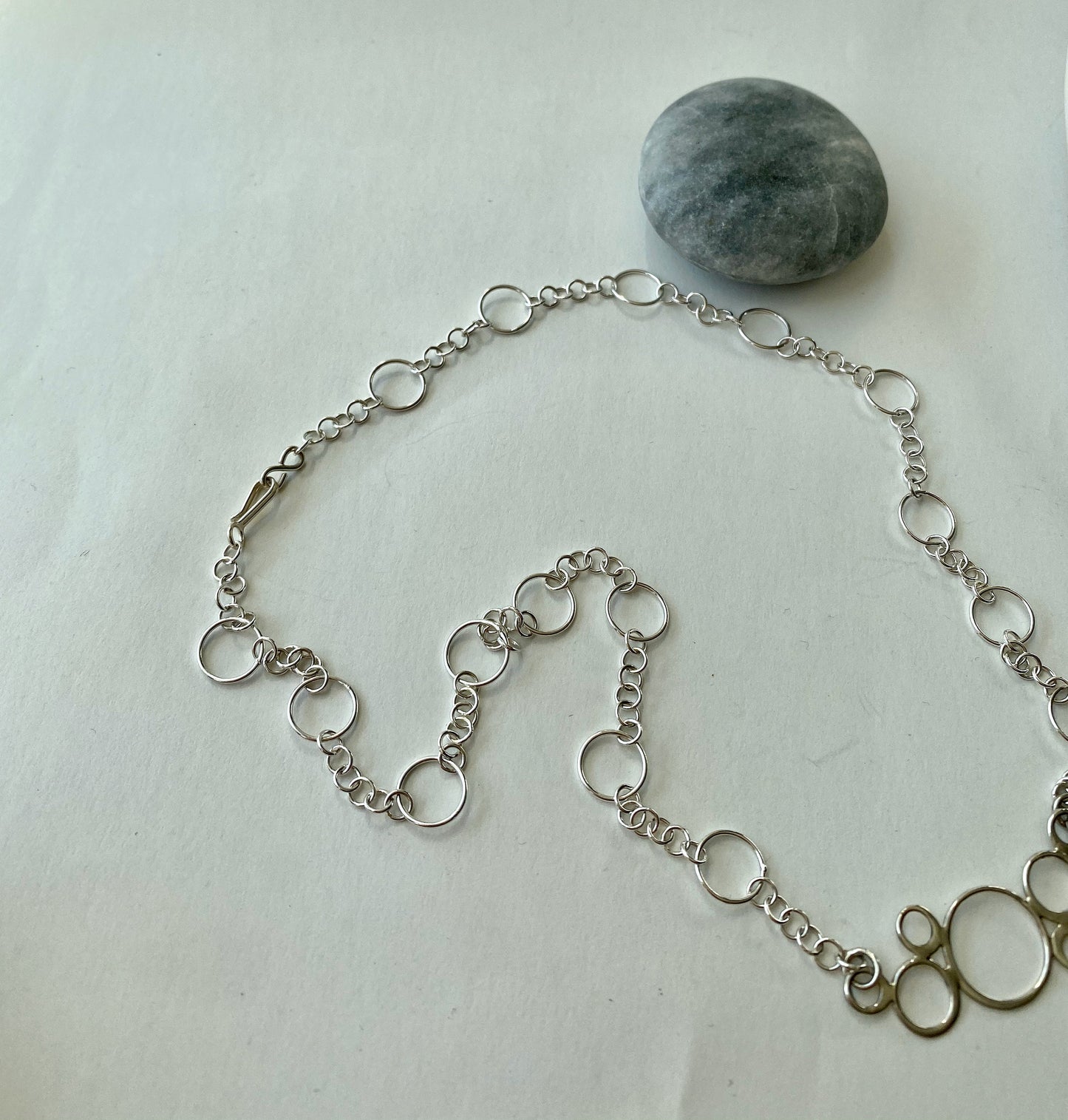 Beautiful quality sterling silver multi-circle pendant. Strung on quality sterling silver chain. Beautiful graduation gift.