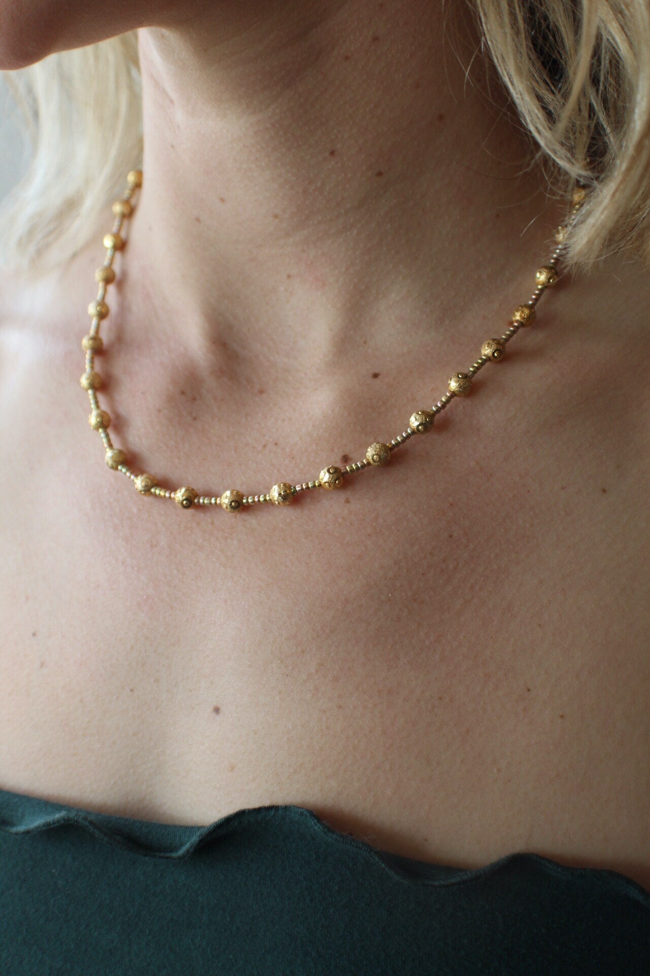 Gorgeous gold satellite beads spaced and accented with gold seed beads. Finished with a quality gold filled clasp.