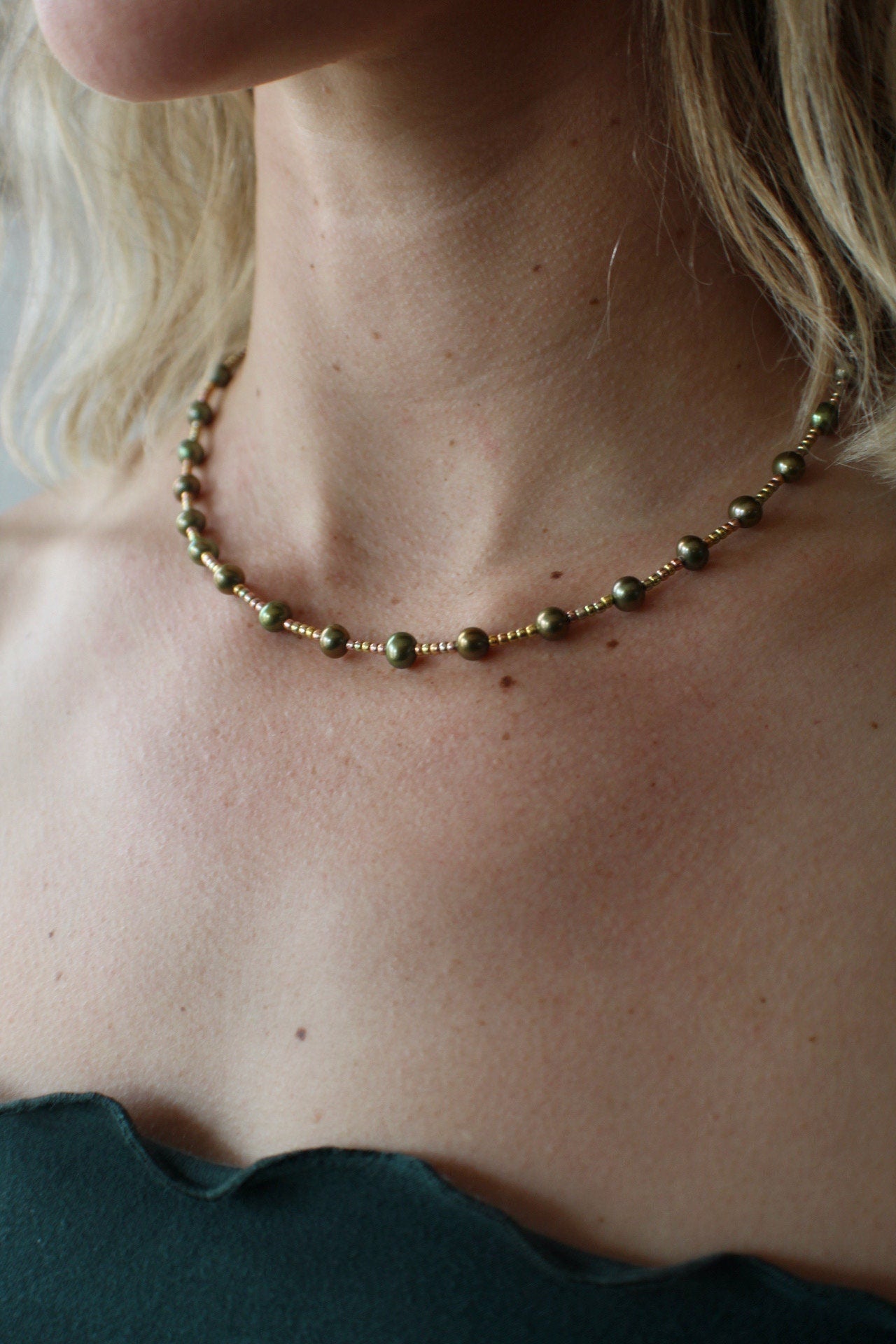 Stunning sweet green pearl necklace.  These pearls are accented with gold seed beads, and a gold filled clasp.