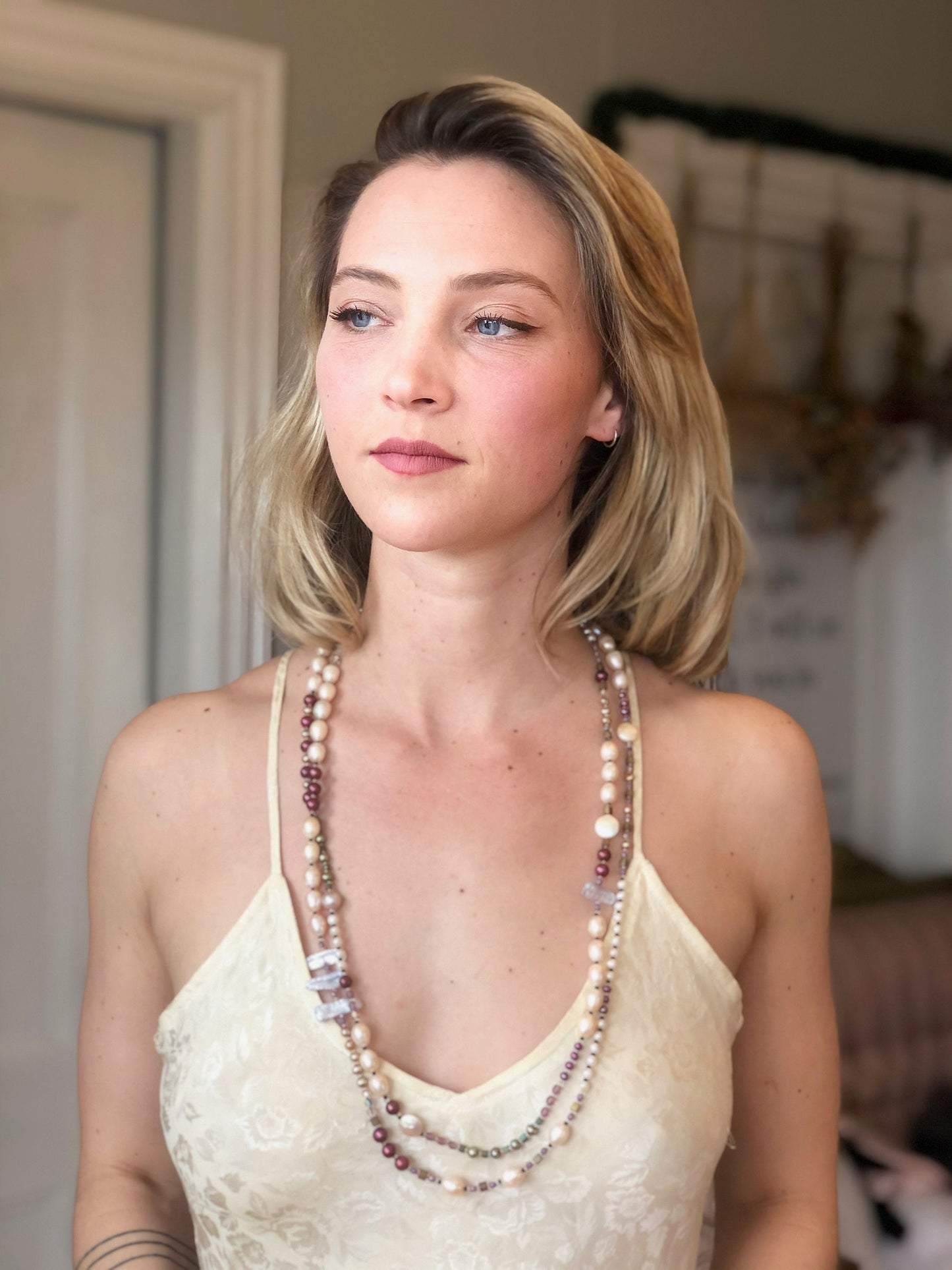 Long fresh water pearl necklace  Rows and rows of pearls are accented by crystals and quality sterling silver beads.