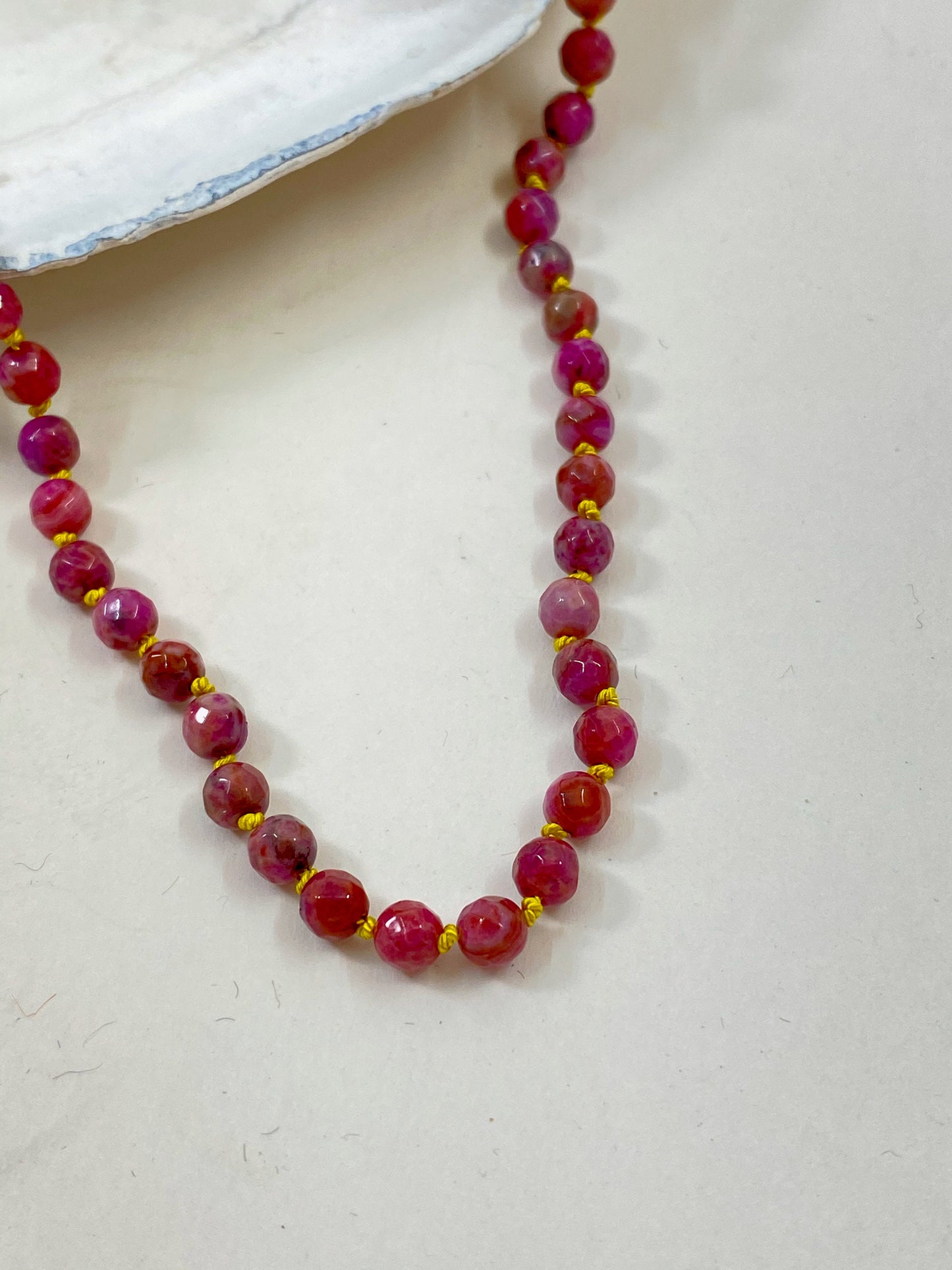 Children's precious rose agate beaded necklace. Knotted safely with silk thread, to be worn in sweetness and joy.