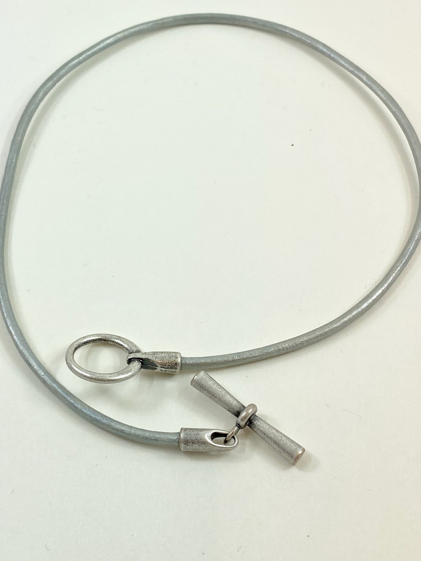 Leather Necklace. Hip silver Italian leather choker necklace fashioned with a center silver toggle clasp.