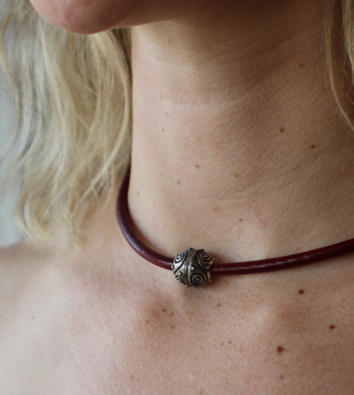 Leather Necklace. Gorgeous red Italian leather choker necklace fashioned with a center silver ornate magnetic clasp.