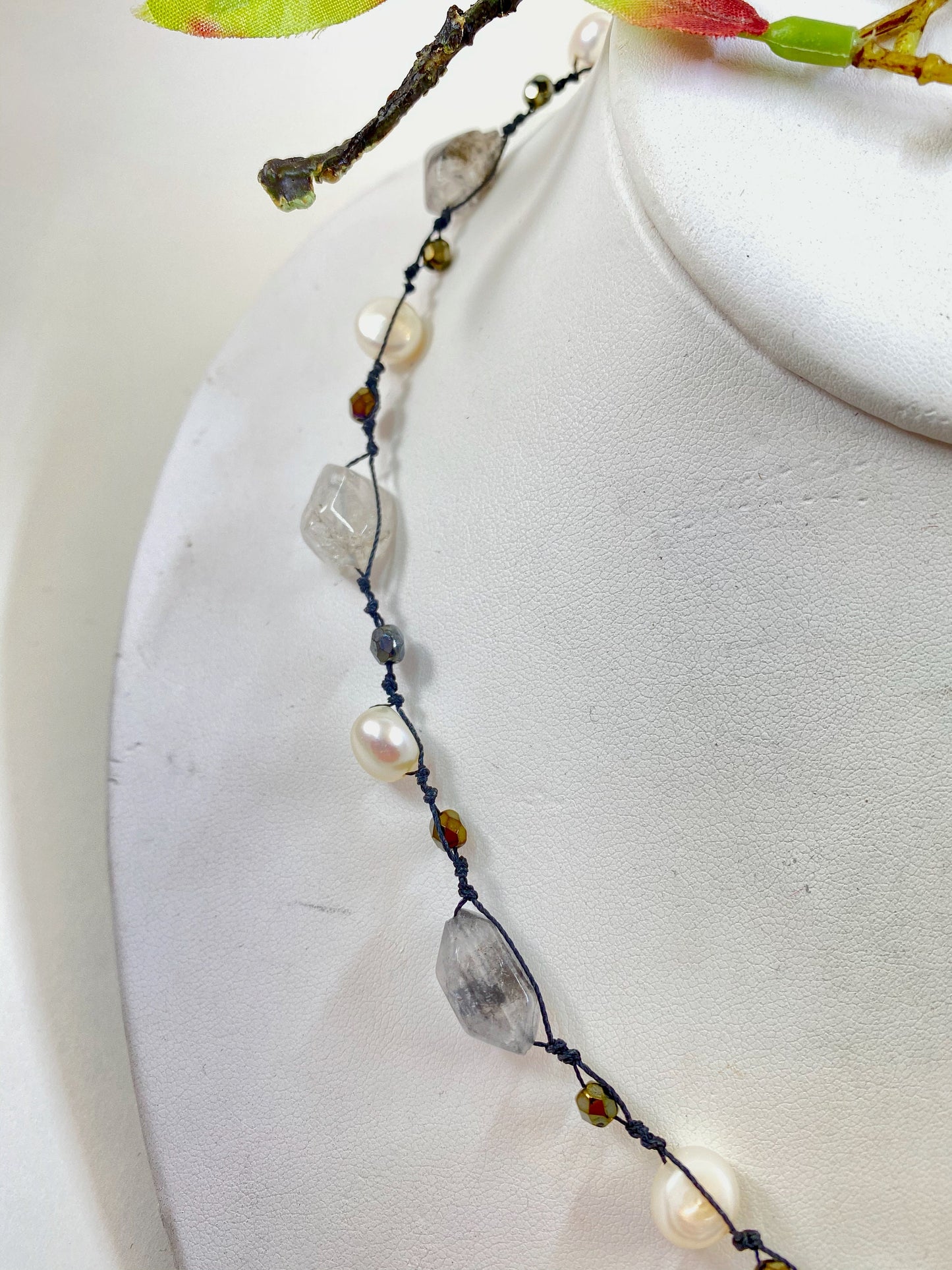 Pearls. Beautiful knotted quartz crystal and white fresh water pearl necklace. This necklace is hand knotted with black silk thread. Sterling clasp.