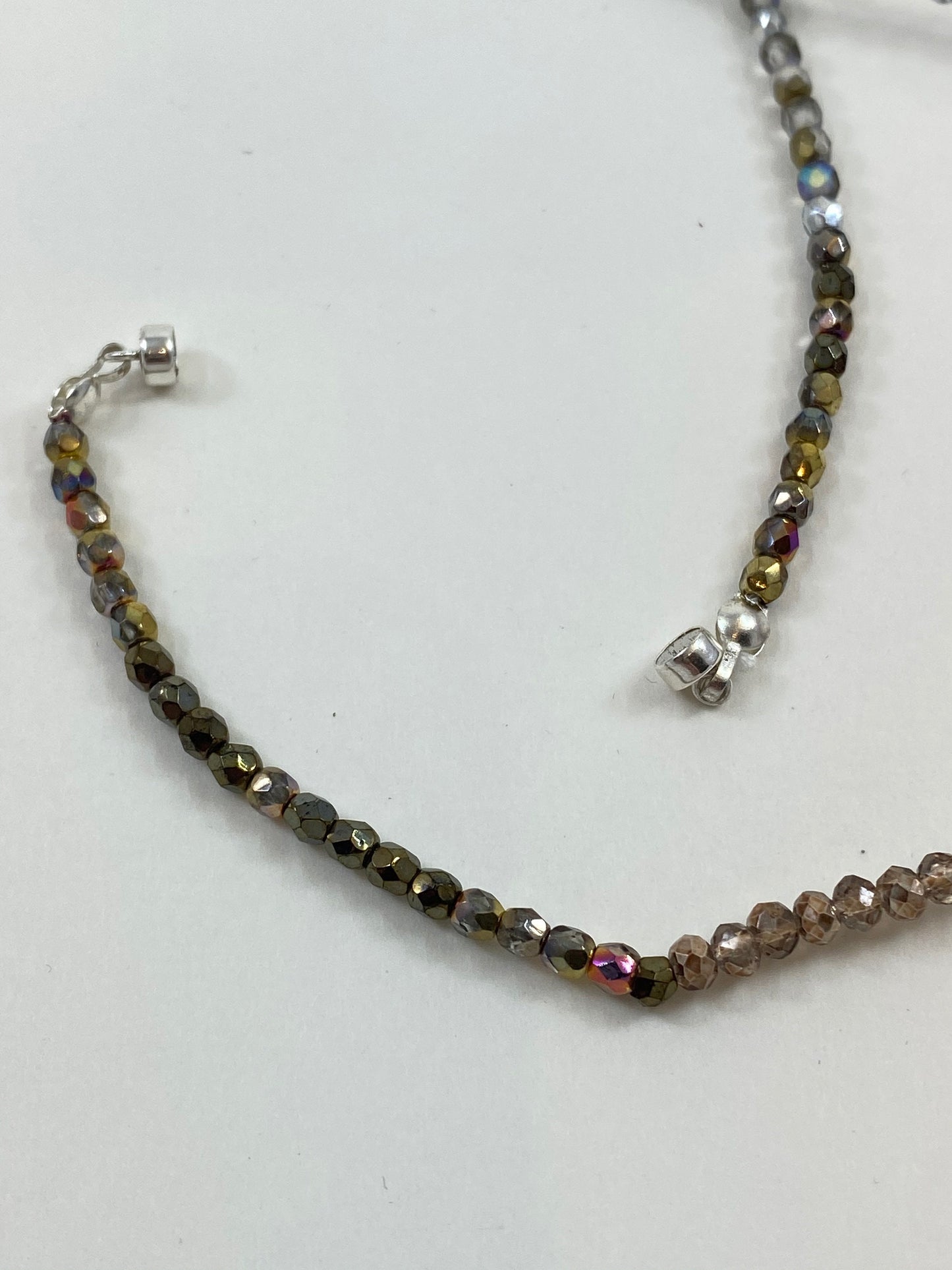 Stunning crystal necklace, with multi colors and designed to wear long or short. Finished with a quality sterling silver magnetic clasp.