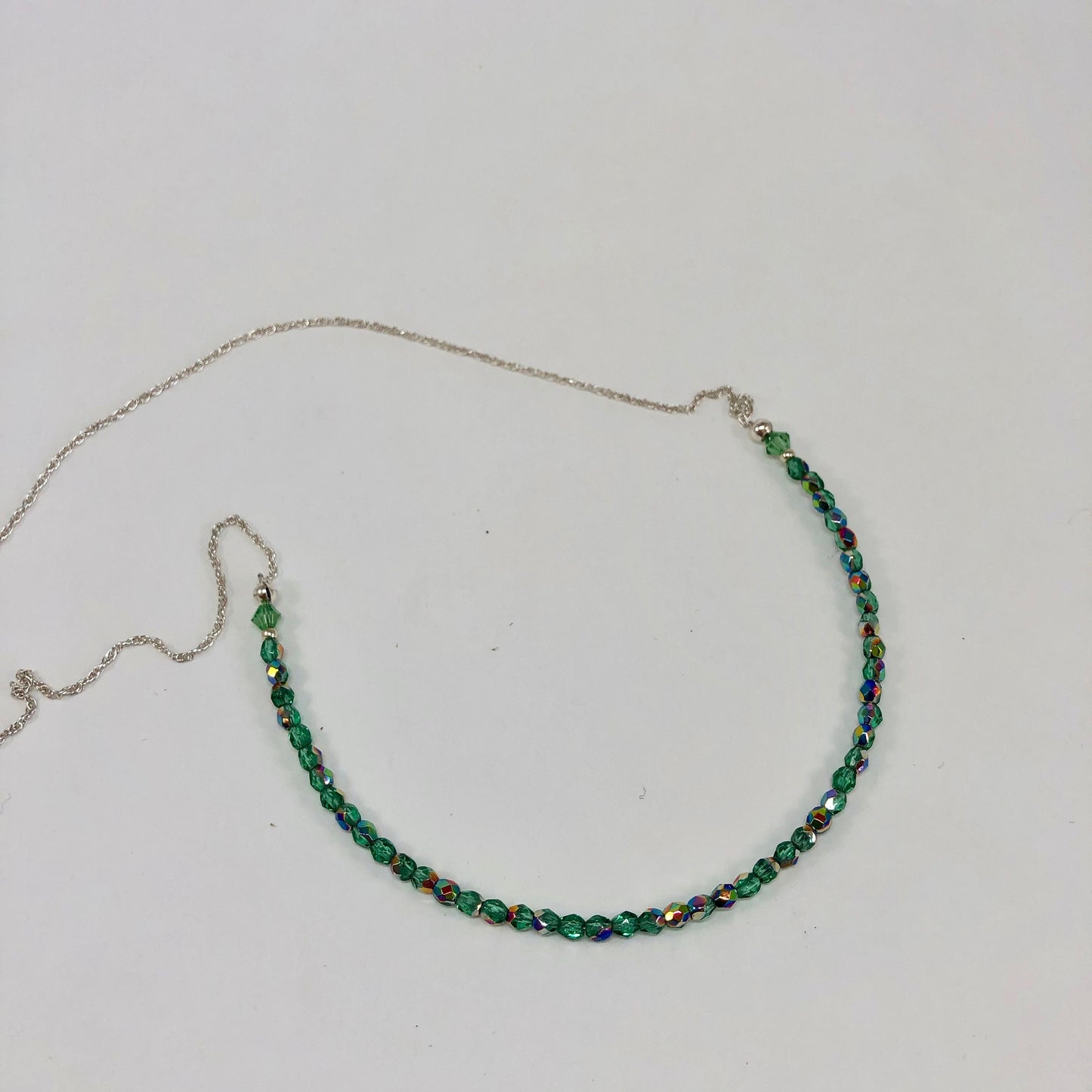 Emerald green crystal and sterling silver choker necklace.