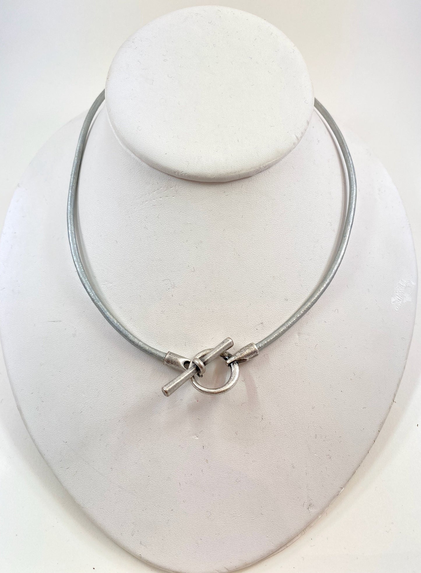 Leather Necklace. Hip silver Italian leather choker necklace fashioned with a center silver toggle clasp.