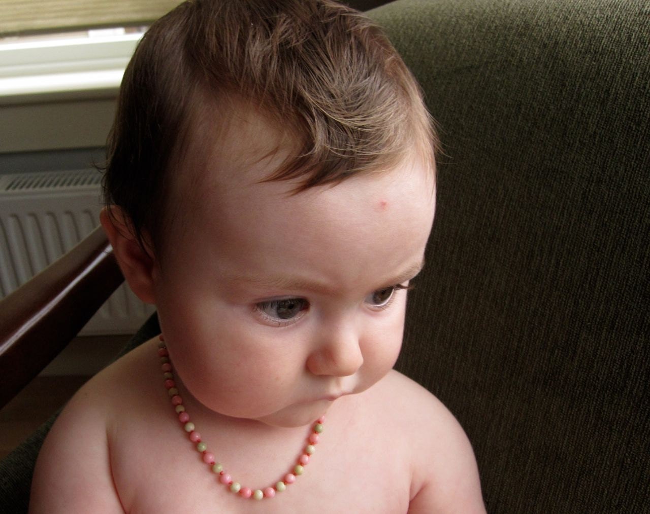 Finely knotted coral and jade necklace for babies and toddlers.