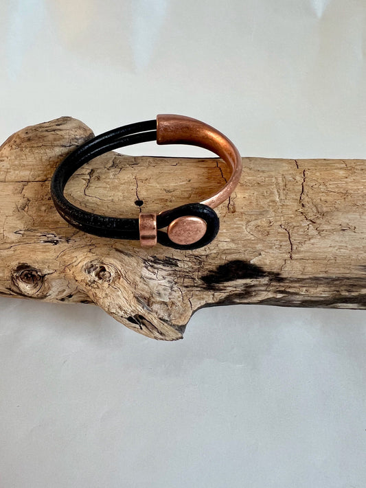 Italian black leather bracelet  with a copper button clasp. Half cuff style. Soft leather and trendy clasp.