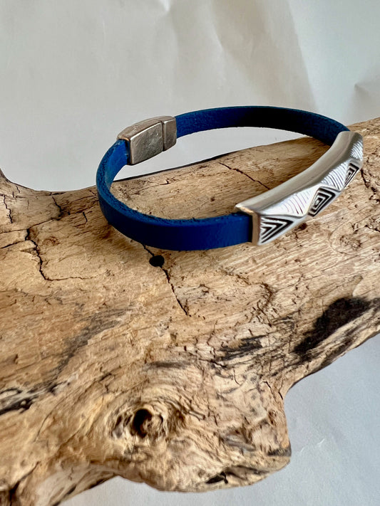 Italian rich blue leather bracelet with a silver fine design silver accent.  Silver magnetic clasp. Soft leather and trendy clasp.