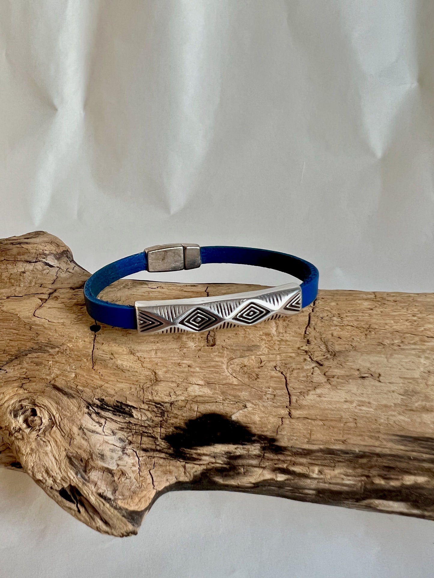Italian rich blue leather bracelet with a silver fine design silver accent.  Silver magnetic clasp. Soft leather and trendy clasp.