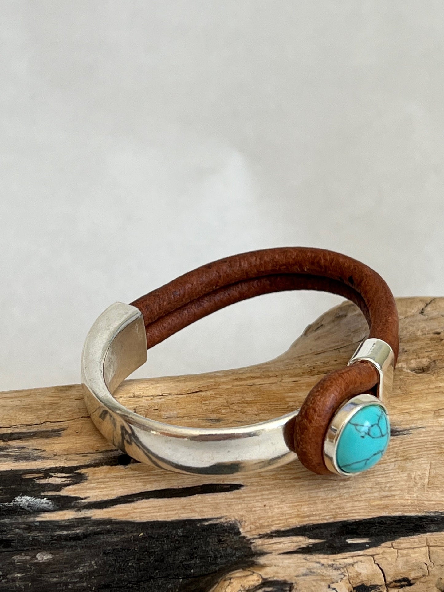 Italian rich distressed brown leather bracelet with a turquoise button clasp. Half cuff style.  Gorgeous turquoise stone, soft leather and trendy clasp.