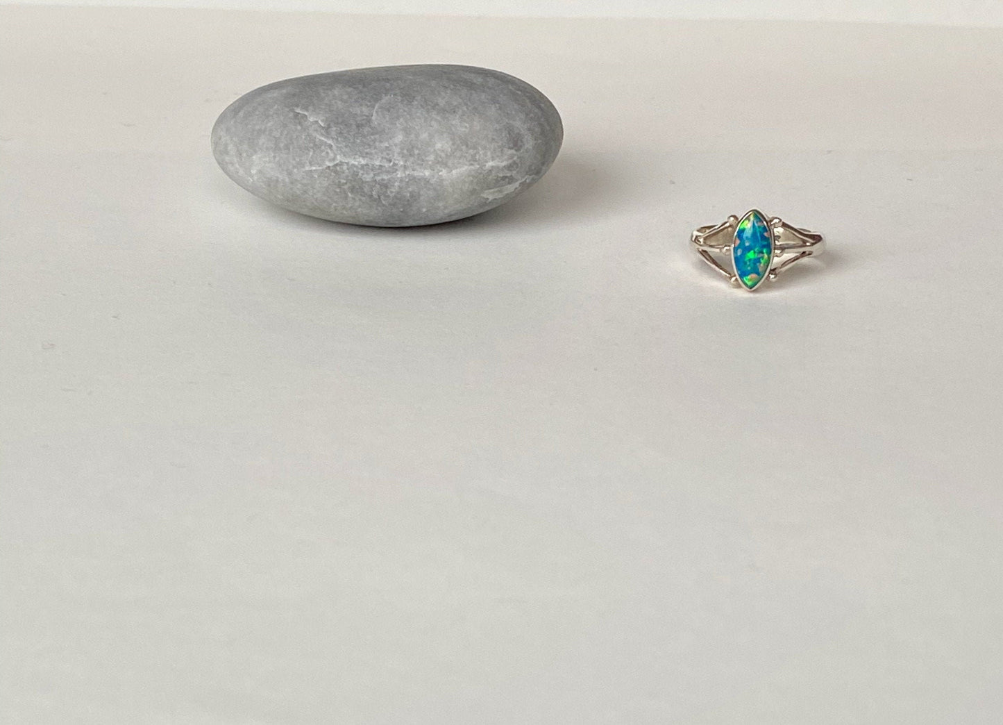 Beautiful size 5 3/4" blue fire opal and sterling silver ring.