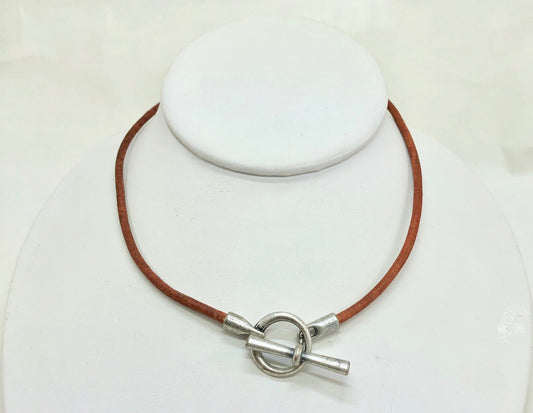 Leather Necklace. Hip brown Italian leather choker necklace fashioned with a center silver toggle clasp.
